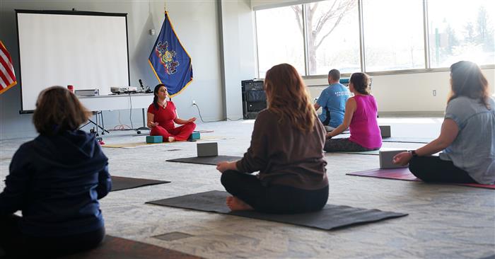 Attendees participate in yoga.